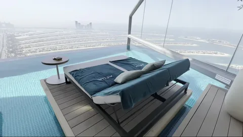 Private daybed platform in pool at Aura Skypool with Palm view